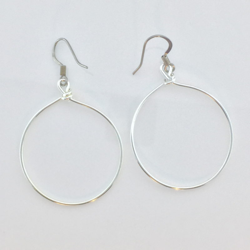 https://sensitively-yours.com/wp-content/uploads/2019/11/JCL077-Large-Silver-Wire-Hoop-on-white.jpg